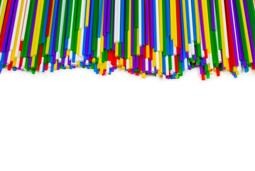 Colorful plastic tubules isolated on white.