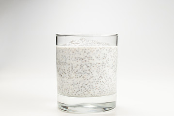 Chia pudding  in glass on a white background. Space for text or design.