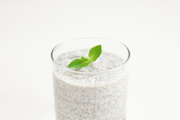 Chia pudding with mint on a white background. Space for text or design.