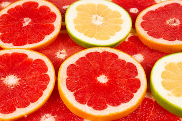 Pomelo and grapefruit slices background.
