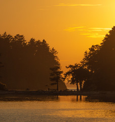 Pacific NW Puget Sound:Sun going down at SSucia Island in the San Juan Island chain in Washington...