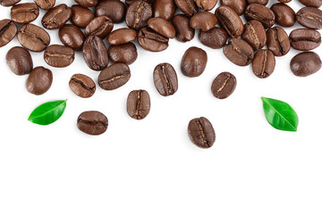 roasted coffee beans with leaves isolated on white background with copy space for your text. Top view. Flat lay. Clipping path and full depth of field