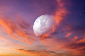 Selbstklebende Fototapeten Hochrot Moon in bright clouds of sunset sun . New moon .  The sky at night with stars.   © yaalan