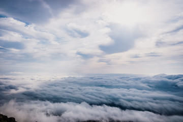 Awesome view on top of the clouds on a cloudy morning.