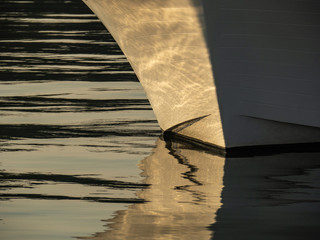 Pacific NW Puget Sound: Boat bow form reflecting on the water