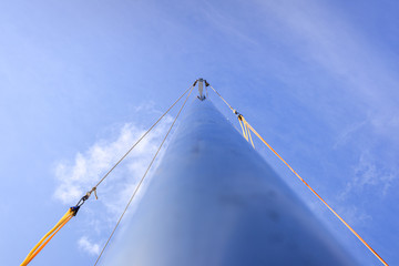 Main mast of a sailboat seen from below.