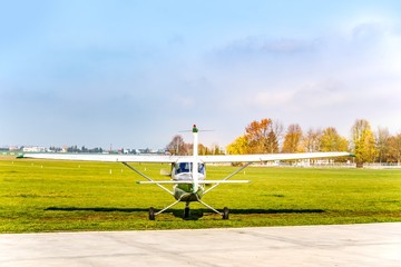 Fototapeta premium Small aircraft on runway . take-off of the plane