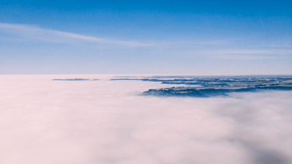 foggy valley with blue sky