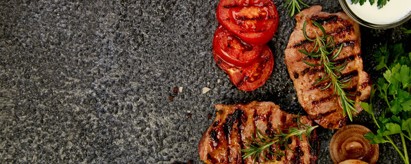 Banner with Steak pork grill with a variety of grilled vegetables