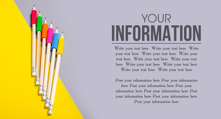 Pencils with rubber on color yellow gray background, top view, space for text