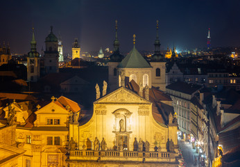 Prague - The Old Town from east tower of Charles bridge with the Klementinum - St. Salvator church at night