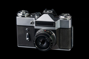 old retro 35 mm camera on a black background