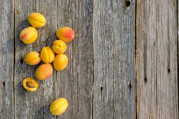 Fototapeta na wymiar Apricots. Ripe fresh apricots on a wooden vintage background, top view