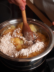 Add Cinnamon and Powdered Sugar into boiled apples. Making Apple Pie Tart Series.