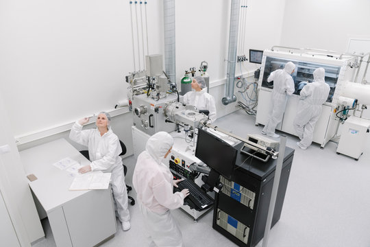 Team of scientists working in laboratory of technology center