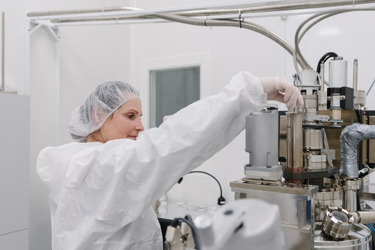 Laboratory technician working on a device in laboratory of science center