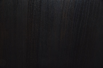 Wood texture. Background made of brown, dark wood, panels or wooden veneer.