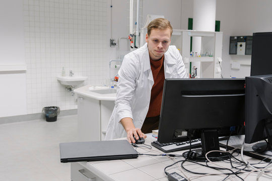 Scientist using computer in laboratory of technology center