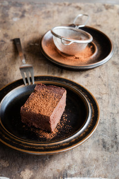 Plate with homemade gluten and sugar free brownie made with teff flour