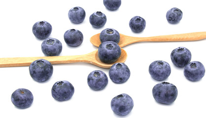 group of blueburry fruit in wooden spoon. Isolated on white background