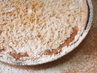 Sprinkle freshly baked pie with powdered sugar. Making Apple Pie Tart Series.