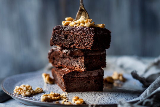 Stack of homemade gluten free brownies with chocolate and coffee glazing