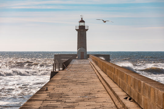 Portugal, Porto District, Porto, Felgueiras Lighthouse With Clear Line Of Horizon Over Atlantic Ocean In Background