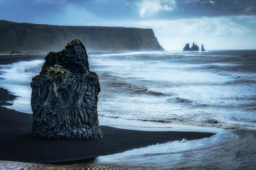volcanic rock formation of Dyrholaey near Vik in stormy weather southern Iceland