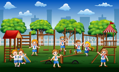 Happy school children playing in public park