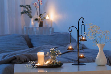 antique candlestick with burning candles in bedroom