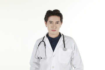 the young asian medical doctor and his stethoscope at isolated white background copy space 