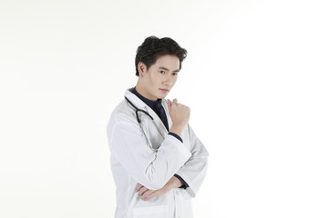 the young asian medical doctor and his stethoscope at isolated white background copy space 