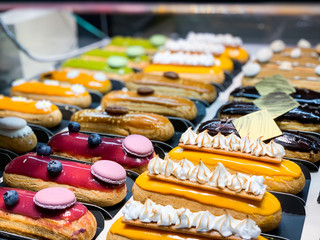 tasty french eclairs with fresh fruits
