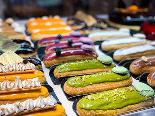 tasty french eclairs with fresh fruits