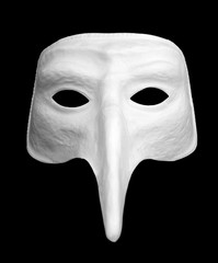 Spooky white venetian style mask on black background.