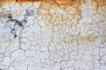 Old cracked and weathered concrete wall.