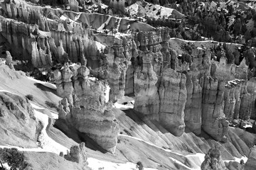 Fototapeta na wymiar Amazing Bryce Canyon National Park landscape in monochrome. Scenic view with amphitheater covered by snow from Inspiration Point. Bryce Canyon National Park, Utah, Southwest USA.