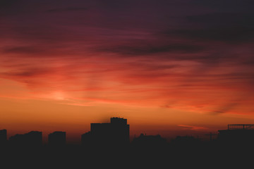 Fototapeta na wymiar Sunrise over city with cloudy sky, nature
