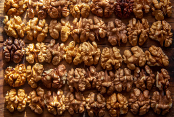 tasty healthy peeled walnuts on a wooden board