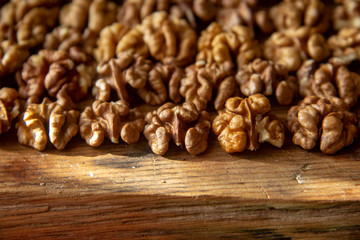 tasty healthy peeled walnuts on a wooden board