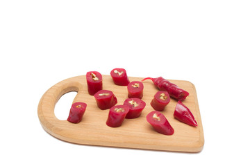 Churchkhela cut into pieces on a wooden board isolated, Georgian national sweet