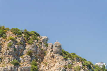 Mountains and rocks on the beach in summer on a Sunny day