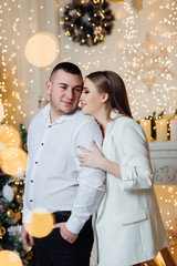 Sweet couple Love smile and spending Romantic christmas time and celebrating new year eve, birthday, and valentine on decoration in living room at home. Christmas time