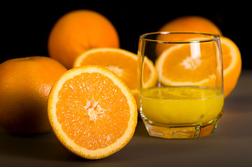 Fresh orange juice. Orange juice in a beautiful glass. Juicy orange.