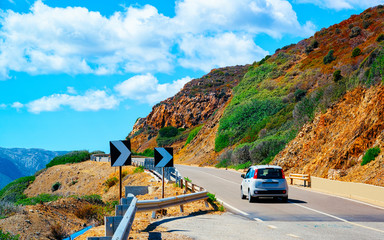 Car on the road at in Sardinia Island in Italy summer. Transport driving on the highway of Europe....