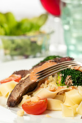 tagliatelli with steak slices on a plate