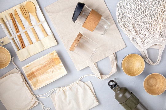 Zero waste kit. Set of eco friendly bamboo cutlery, mesh cotton bag, reusable coffee tumbler and water bottle. Sustainable, ethical, plastic free lifestyle.