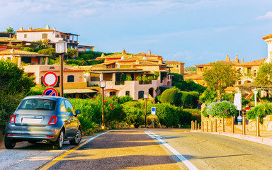 Cars on road in Porto Cervo at in Sardinia Island in Italy summer. Transport Driving on the highway...