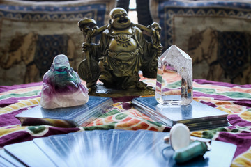 tarot cards in a table with chrystals