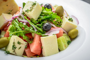 Greek salad with hard cheese and olives